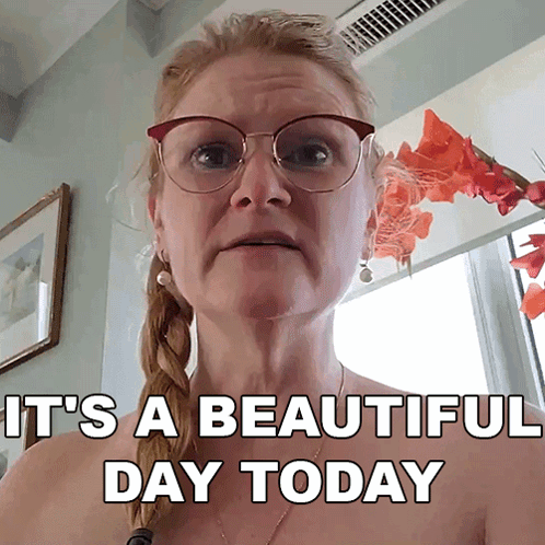 Woman With Glasses and Braids Says It's a Beautiful Day