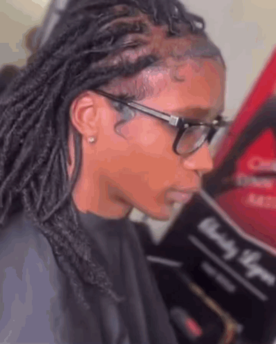 Woman With Glasses And Dreadlocks Getting Hair Done At Salon GIF
