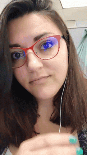 Woman With Glasses and Earbuds