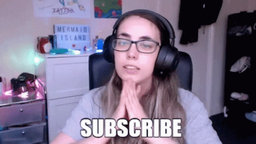 Woman with Glasses and Headphones Says Subscribe