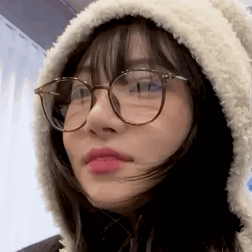 Woman With Glasses And Hooded Jacket GIF