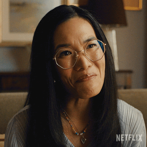 Woman With Glasses And Necklace Netflix Logo GIF
