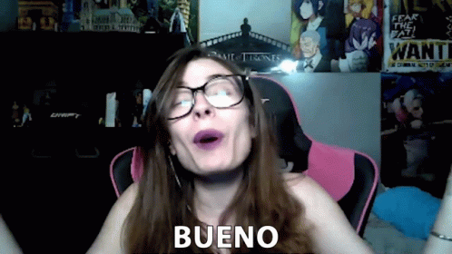 Woman With Glasses And Purple Lipstick Says Bueno Near Wanted Poster GIF
