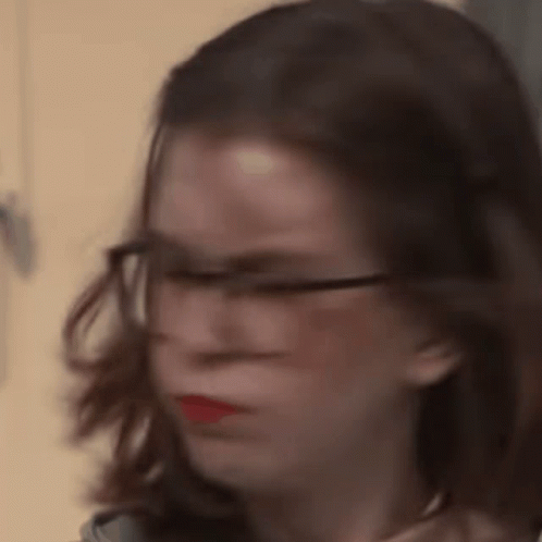 Woman With Glasses and Red Lipstick Making Funny Face