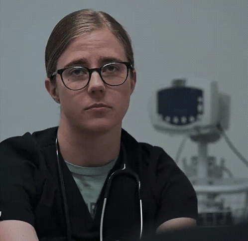 Woman With Glasses and Stethoscope Looking at Camera