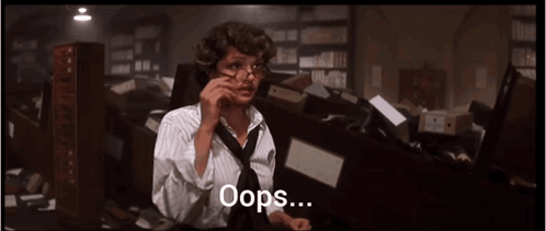 Woman with Glasses and Tie on Phone Oops