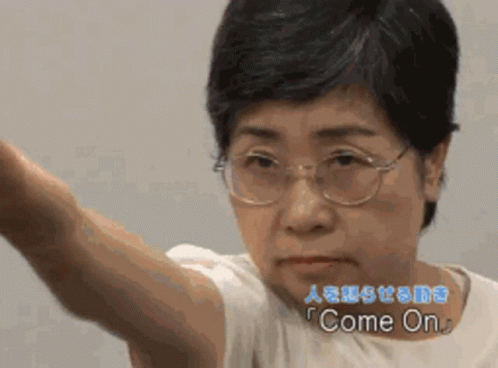 Woman With Glasses and White Shirt Saying Come On
