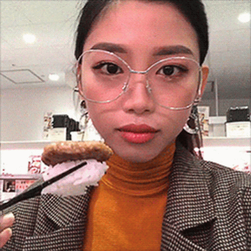 Woman With Glasses Holding Food