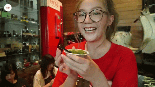 Woman With Glasses Holding Green Drink GIF