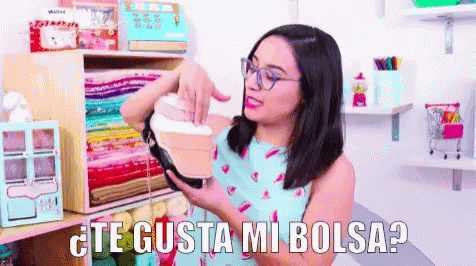 Woman With Glasses Holding Purse Saying Te Gusta Mi Bolsa