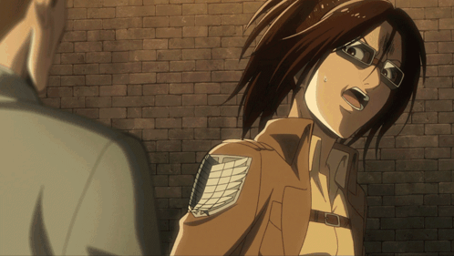 Woman With Glasses In Front Of Brick Wall Mouth Open GIF