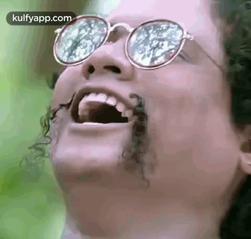 Woman With Glasses Laughing Bug Coming Out Of Mouth GIF