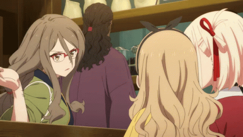 Woman With Glasses Looking in Mirror