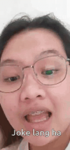 Woman With Glasses Making Funny Face GIF
