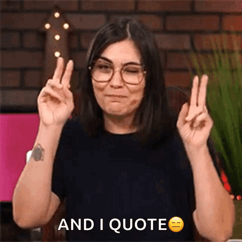 Woman With Glasses Making Peace Sign Saying And I Quote