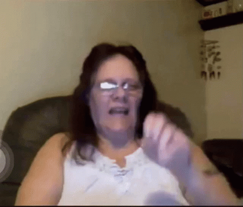 Woman With Glasses On Couch GIF