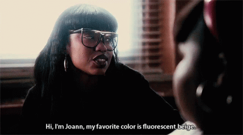 Woman with Glasses Says Hi I'm Joann Fluorescent Beige
