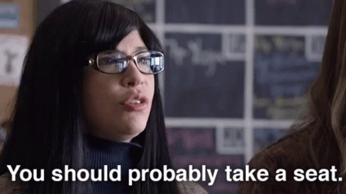 Woman With Glasses Says You Should Probably Take Seat GIF