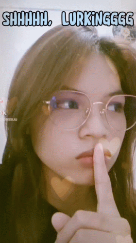 Woman with Glasses Shushing Saying Shhh Lurking
