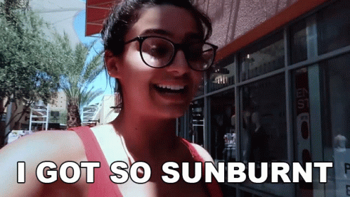 Woman with Glasses Smiling and Saying Sunburnt