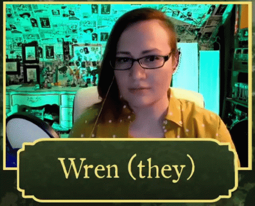 Woman With Glasses Yellow Shirt Says Wren (They)