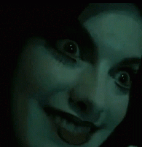 Woman With Glowing Eyes And Tongue Out GIF