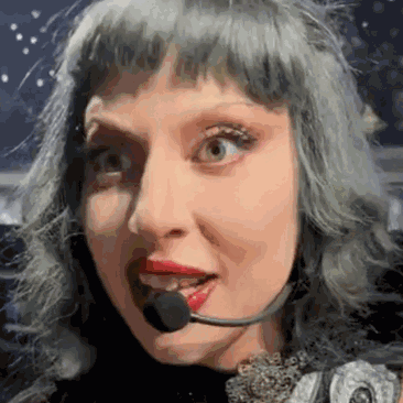 Woman With Gray Hair and Red Lips Wearing Headset Microphone