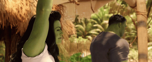 Woman With Green Arms Next To Man GIF