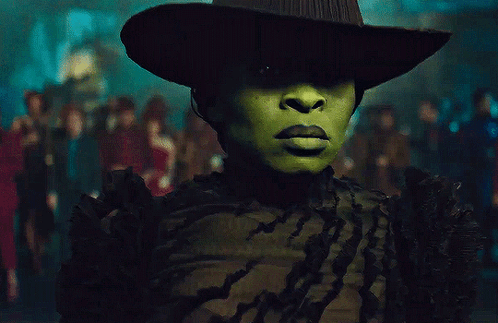 Woman With Green Face Paint and Hat