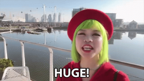 Woman With Green Hair and Red Beret Says Huge