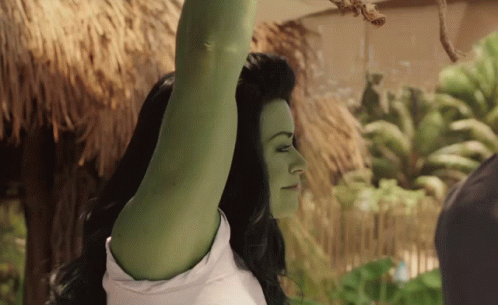 Woman With Green Hair and White Shirt Arm Up