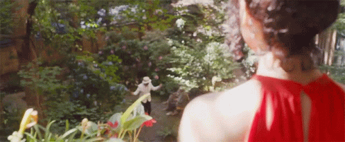 Woman with Green Hair Dancing at Grave