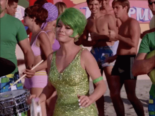 Woman with Green Hair Dancing in Front of PM Sign