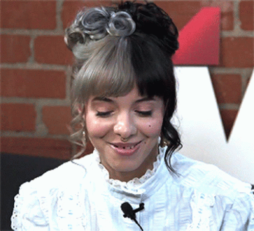 Woman With Half Gray Half Black Hair Smiling