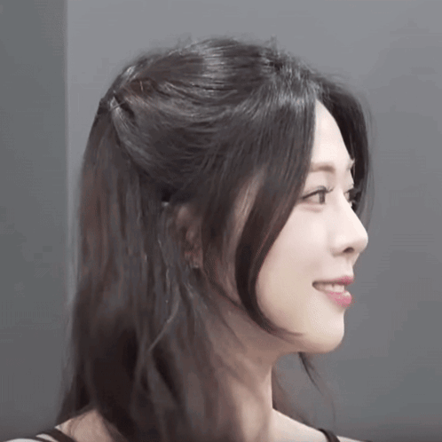 Woman with Half-Up Half-Down Hairstyle Smiling