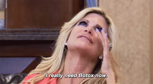 Woman With Hand on Forehead Saying Need Botox