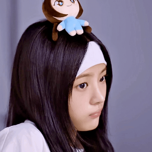 Woman With Headband And Stuffed Animal On Head GIF