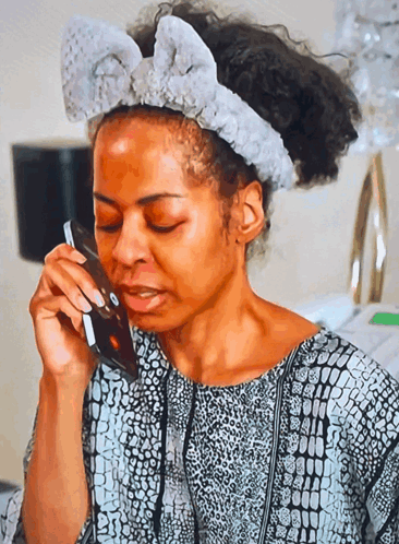 Woman With Headband Talking on Phone