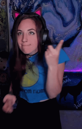 Woman With Headphones and Blue Shirt From Nom