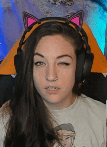 Woman with Headphones and Cat Ears Making Funny Face