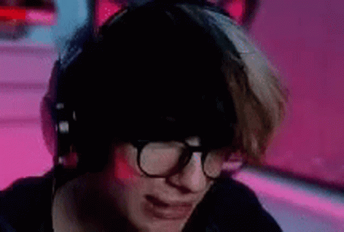 Woman with Headphones and Glasses at Computer