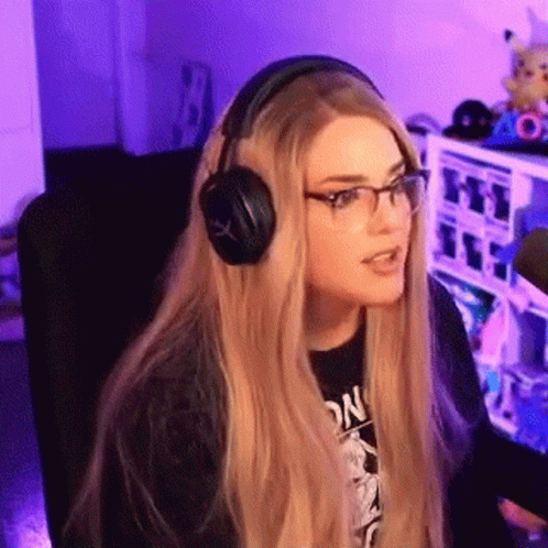 Woman with Headphones and Glasses at Microphone