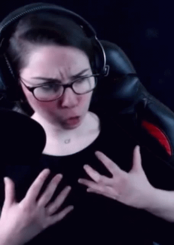 Woman With Headphones and Glasses Making Funny Face