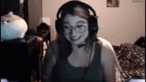 Woman With Headphones And Glasses Smiling At Computer GIF
