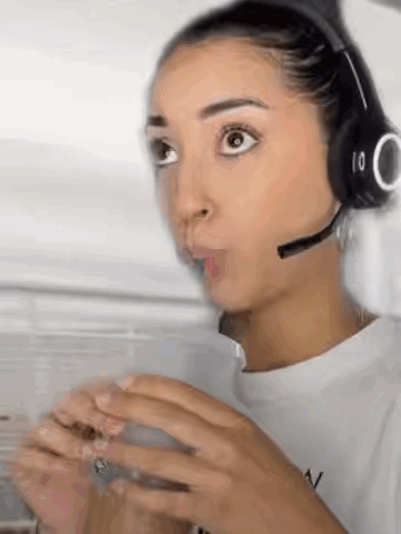 Woman With Headphones And Microphone Holding Coffee GIF
