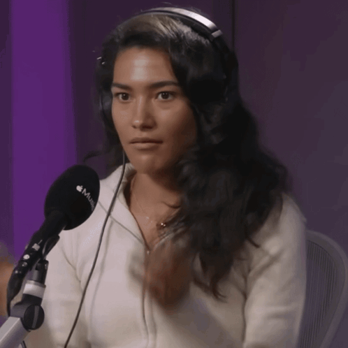 Woman With Headphones And Microphone Saying Music GIF
