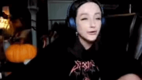 Woman With Headphones and Pumpkin Cope