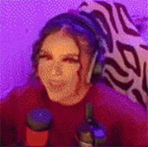 Woman with Headphones at Microphone in Purple Room
