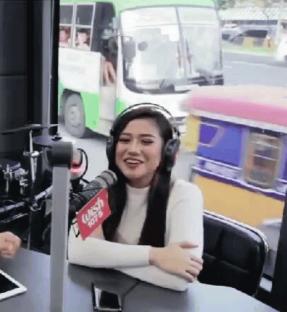 Woman with Headphones at Microphone Wish 107.9
