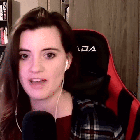 Woman With Headphones On Red and Black Chair Letter A